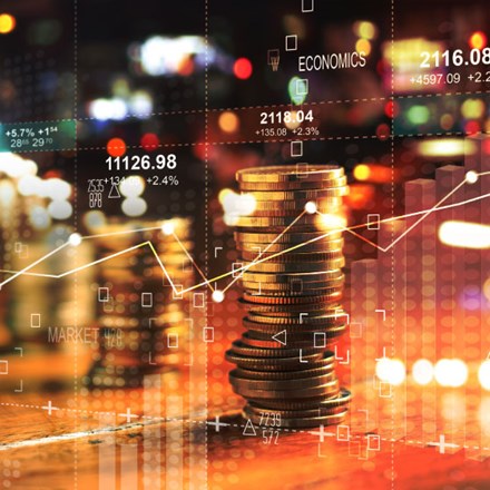 Double exposure with business' charts of graph and rows of coins for finance at night city background.