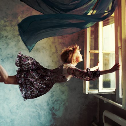 Young woman flying.