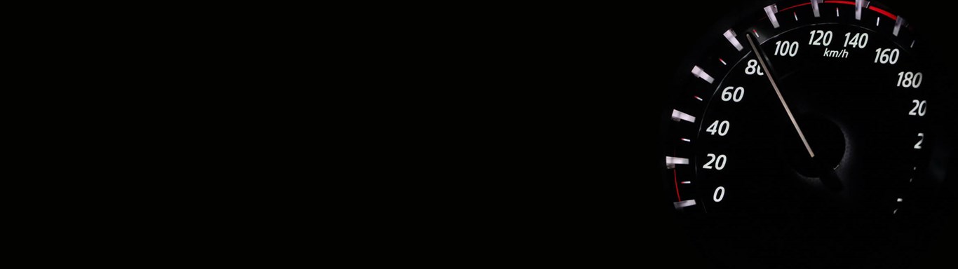 Dark image of a speedometer
