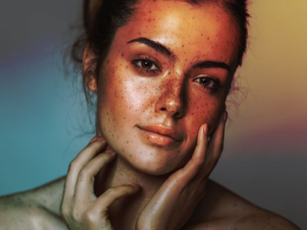Beautiful young girl with freckle. Studio shot