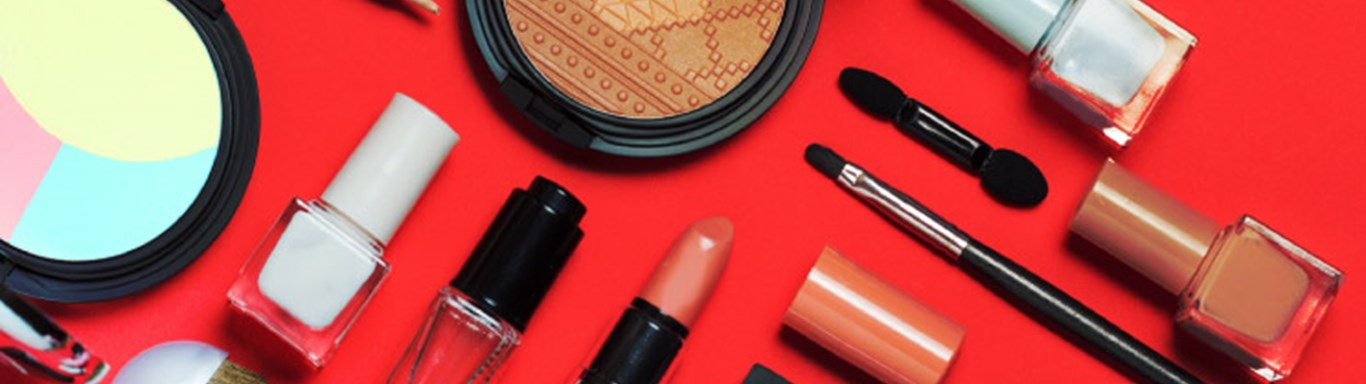 Beauty, decorative cosmetics, flat lay, top view, minimalistic style with red background.