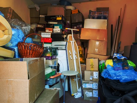 filled garage with boxes and household items