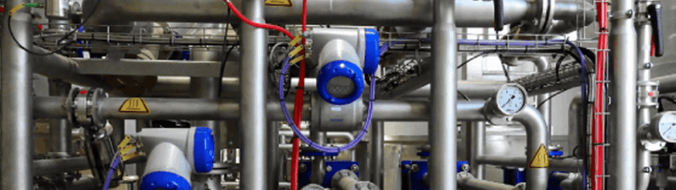 Image of pipes and gauges. A manufacturing plant using a specialised manufacturing ERP system.